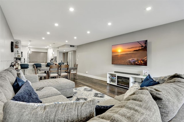 living room featuring dark wood-type flooring