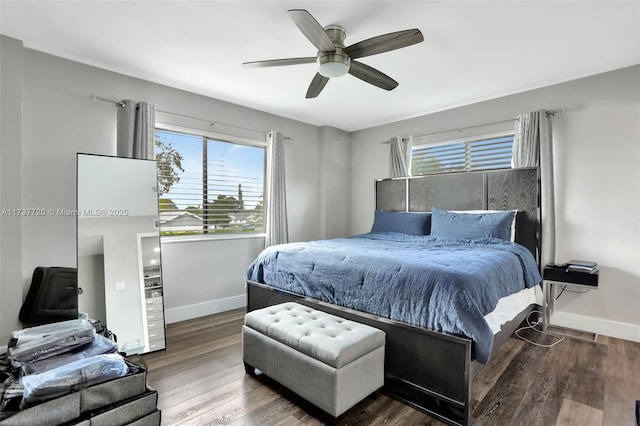 bedroom featuring ceiling fan and dark hardwood / wood-style flooring