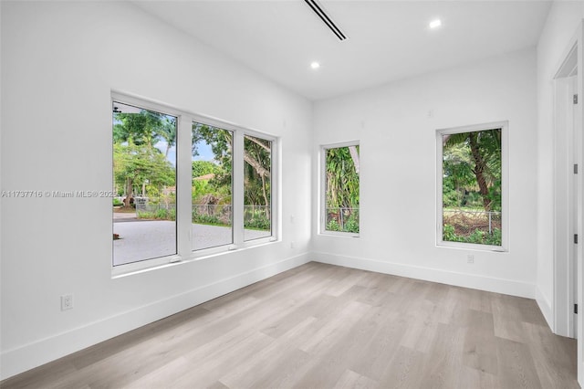 spare room featuring light hardwood / wood-style flooring