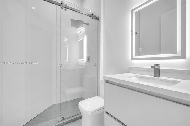 bathroom with vanity, toilet, and an enclosed shower