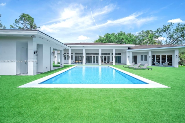 view of pool with a yard