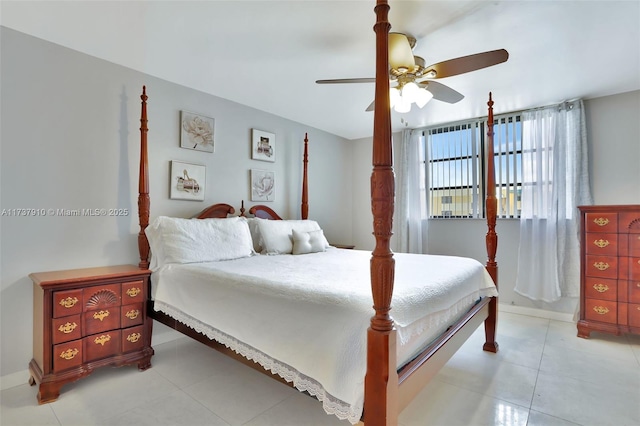 bedroom with light tile patterned floors and ceiling fan