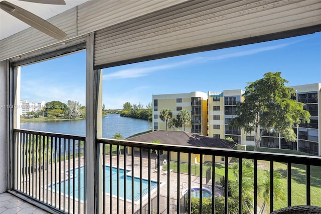 exterior space with a water view and ceiling fan