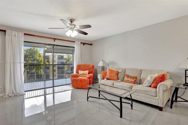 tiled living room featuring ceiling fan