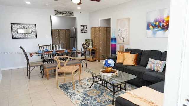 living room featuring light tile patterned flooring and ceiling fan