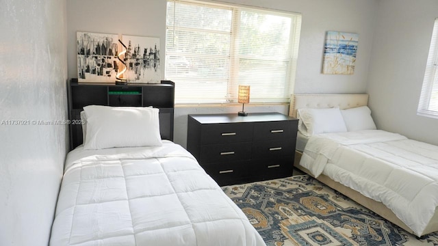 bedroom featuring multiple windows