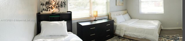 bedroom with wood-type flooring