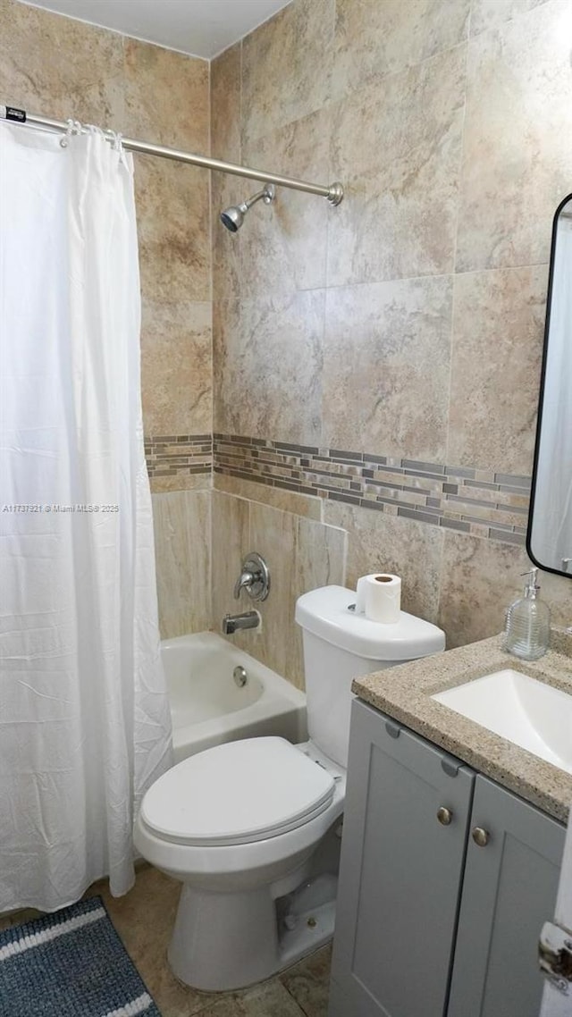 full bathroom with shower / bathtub combination with curtain, tile walls, vanity, decorative backsplash, and toilet