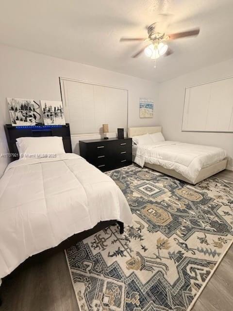 bedroom featuring ceiling fan and hardwood / wood-style floors