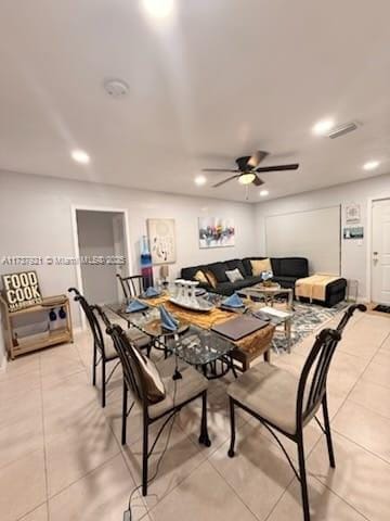 tiled living room featuring ceiling fan