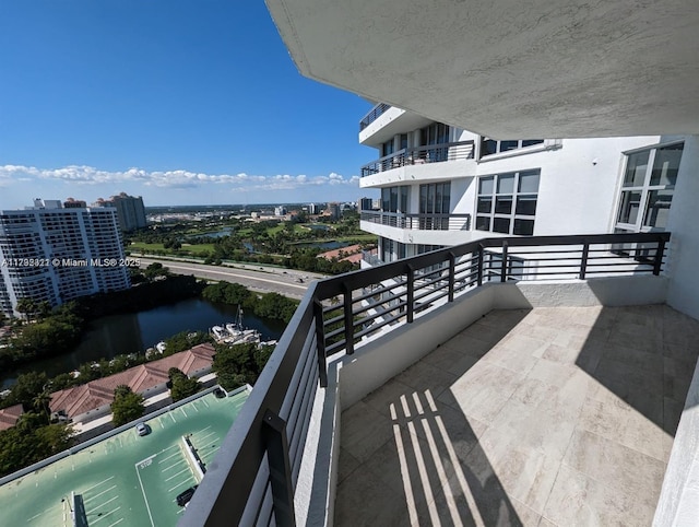 balcony featuring a water view