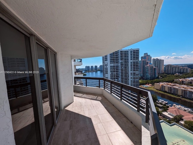 balcony featuring a water view