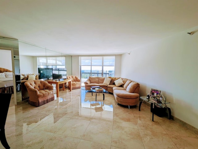 living room featuring a wall of windows