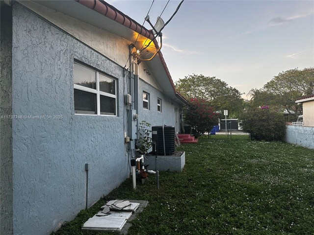 view of yard featuring central AC