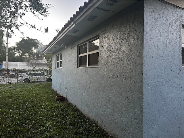 view of property exterior featuring a yard