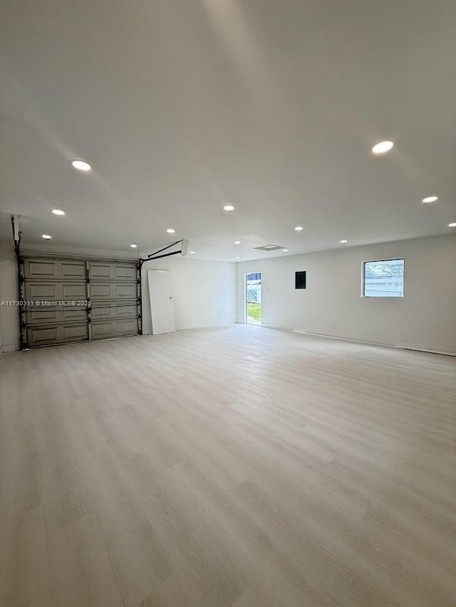 parking garage featuring recessed lighting