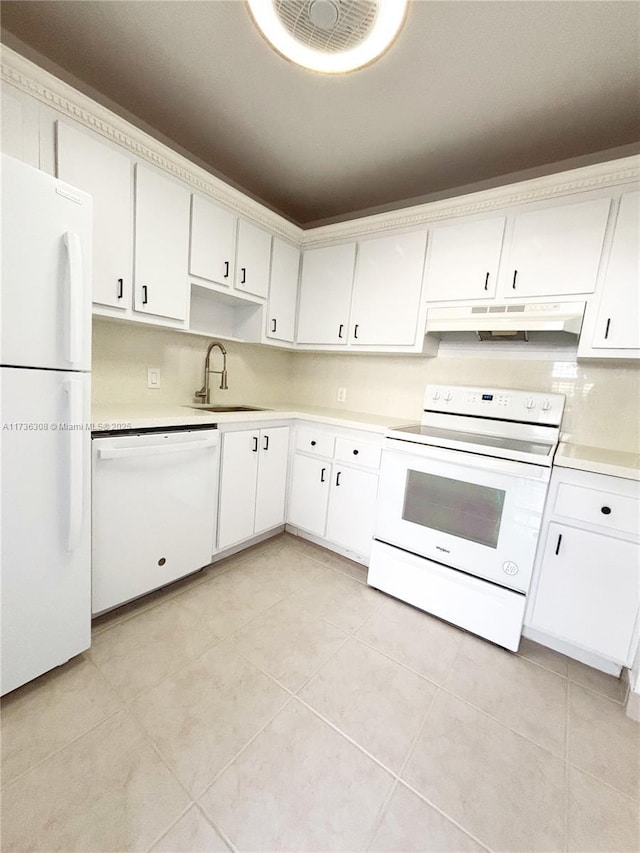 kitchen with sink, white cabinets, and white appliances