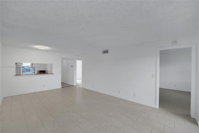 empty room with a textured ceiling