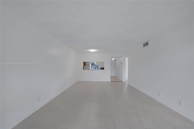 spare room featuring a textured ceiling