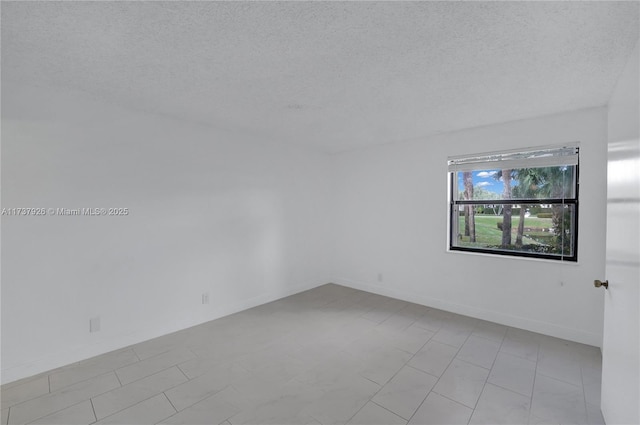 empty room featuring a textured ceiling