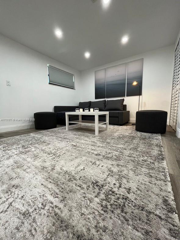 home theater room with hardwood / wood-style floors