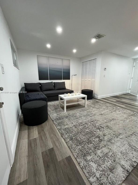 living room featuring wood-type flooring