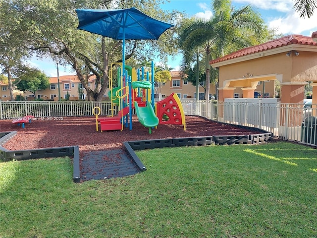 view of playground featuring a lawn