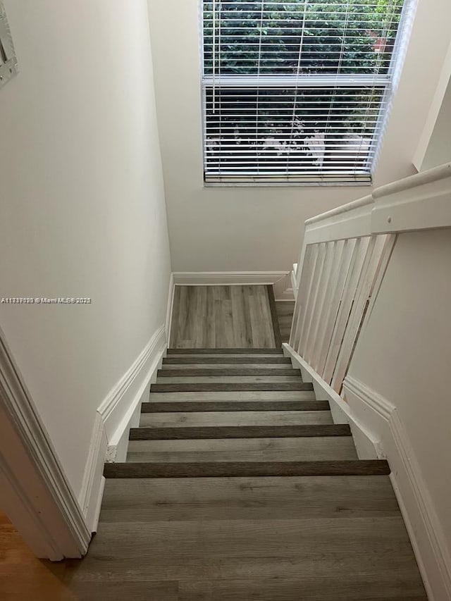 stairway featuring hardwood / wood-style floors