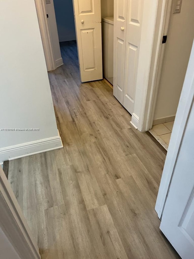 hallway featuring light hardwood / wood-style floors