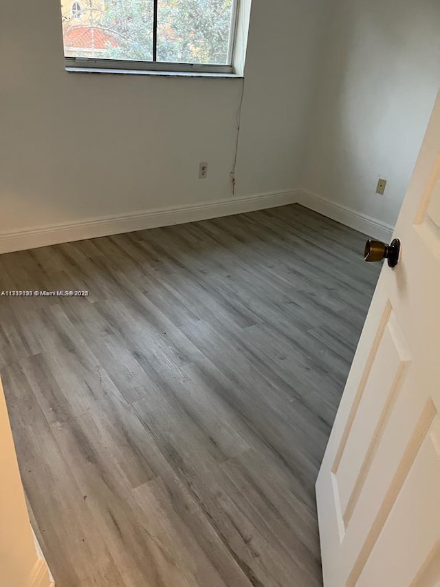 empty room featuring hardwood / wood-style floors