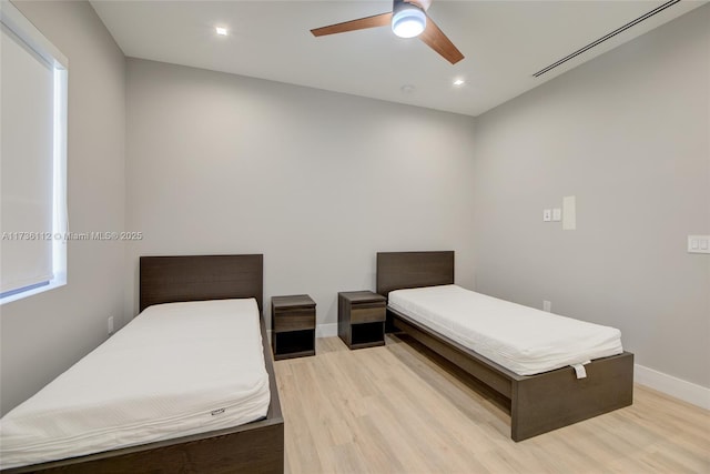 bedroom featuring a ceiling fan, baseboards, light wood finished floors, and recessed lighting