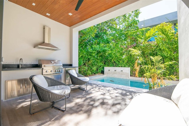 view of patio with area for grilling, a ceiling fan, and an outdoor pool