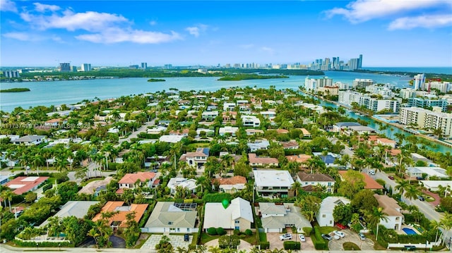 1251 Kane Concourse, Bay Harbor Islands, FL 33154 - aerial view of property and surrounding area featuring skyline, a nearby body of water, and nearby suburban area