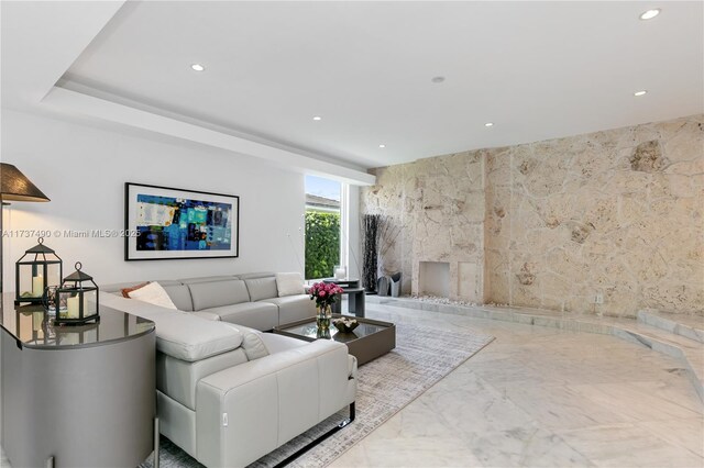 living room featuring tile walls