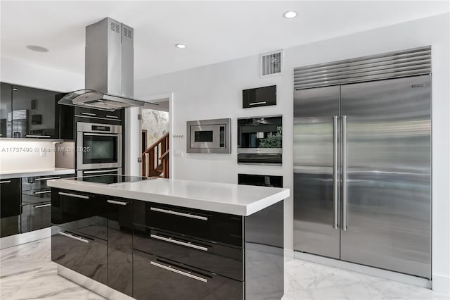 1251 Kane Concourse, Bay Harbor Islands, FL 33154 - kitchen featuring built in appliances, modern cabinets, island range hood, dark cabinets, and light marble finish floors