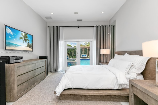 carpeted bedroom featuring access to exterior and french doors