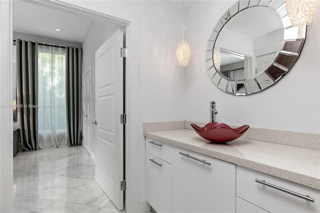 1251 Kane Concourse, Bay Harbor Islands, FL 33154 - bathroom with marble tiled flooring, vanity, and recessed lighting