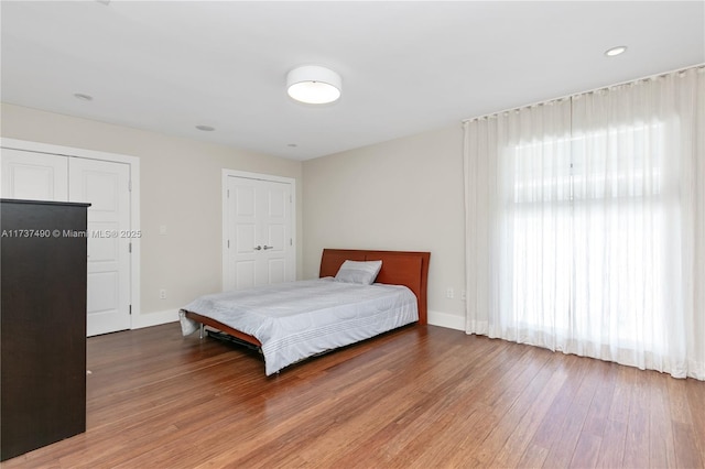 1251 Kane Concourse, Bay Harbor Islands, FL 33154 - bedroom with wood finished floors and baseboards