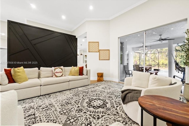 living room with crown molding and ceiling fan