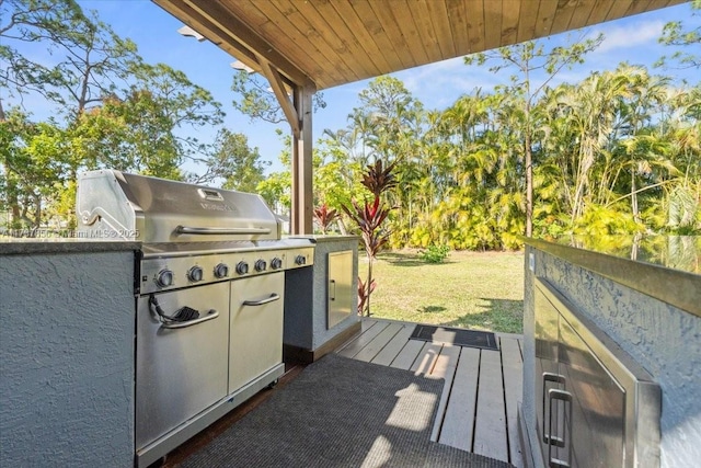 view of patio with area for grilling and exterior kitchen