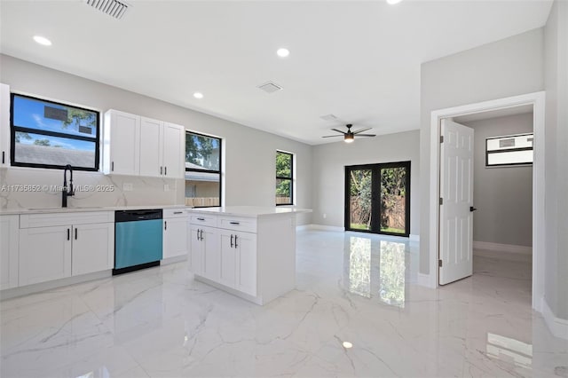 kitchen featuring a kitchen island, white cabinetry, dishwasher, sink, and french doors