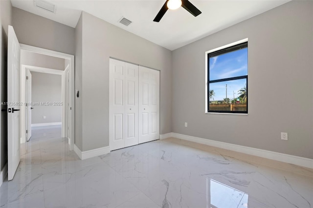 unfurnished bedroom with a closet and ceiling fan