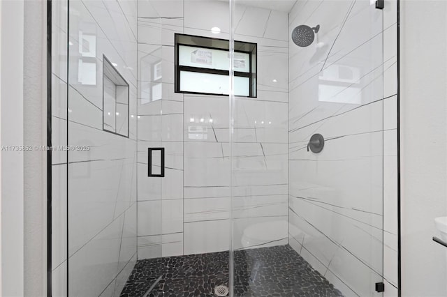 bathroom with toilet and walk in shower