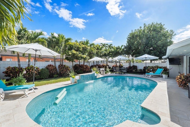 view of swimming pool featuring a patio area and pool water feature