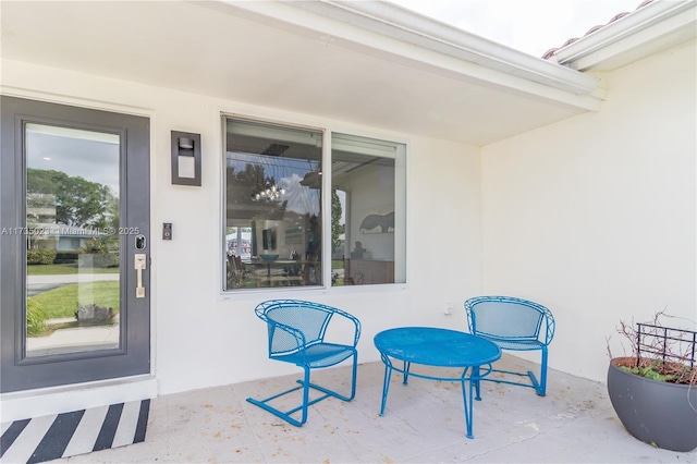 property entrance featuring a patio area