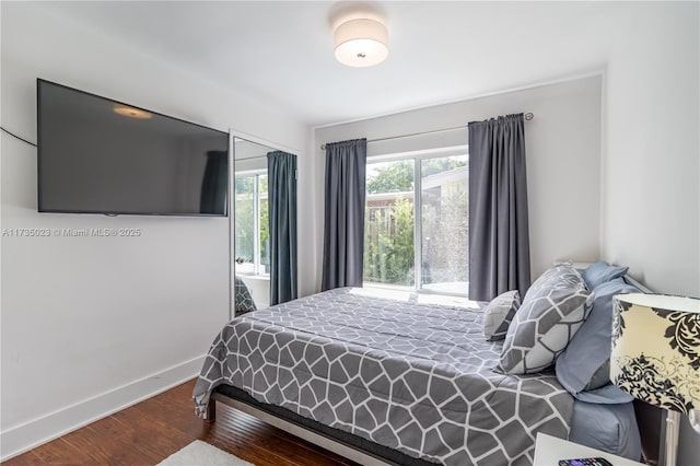 bedroom with wood-type flooring