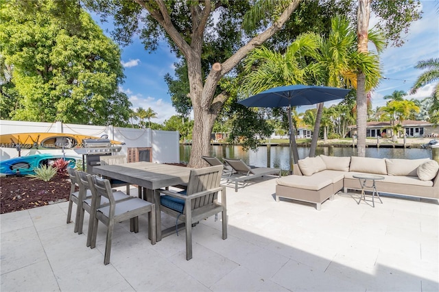 view of patio with a swimming pool, an outdoor hangout area, and a water view