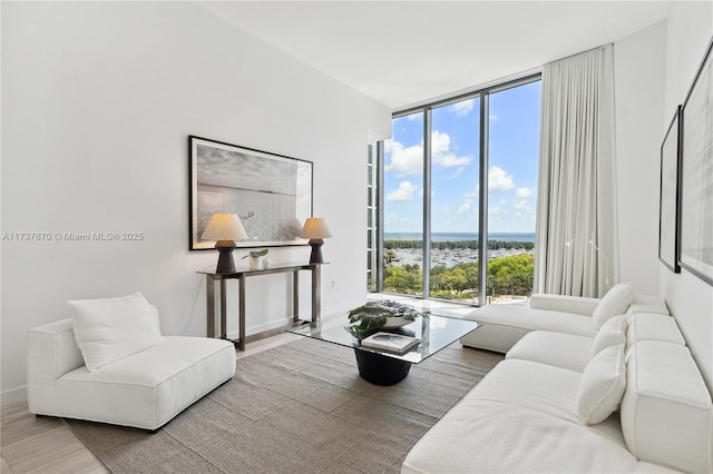 living room with expansive windows and hardwood / wood-style floors