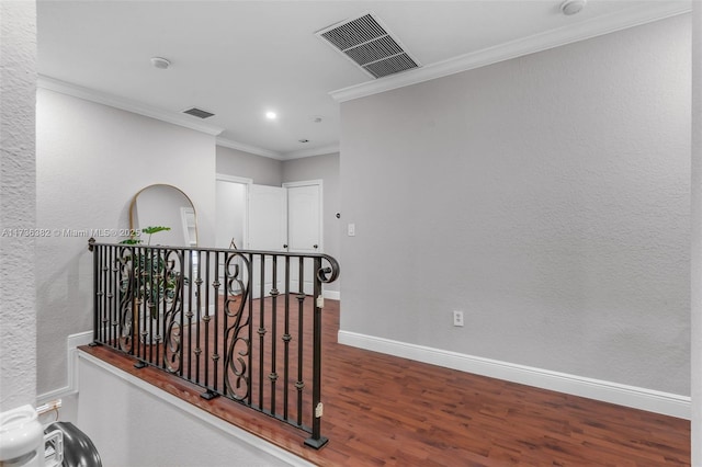 hallway featuring crown molding and dark hardwood / wood-style flooring