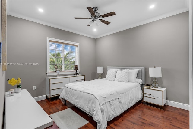 bedroom with dark wood-type flooring, ceiling fan, and ornamental molding